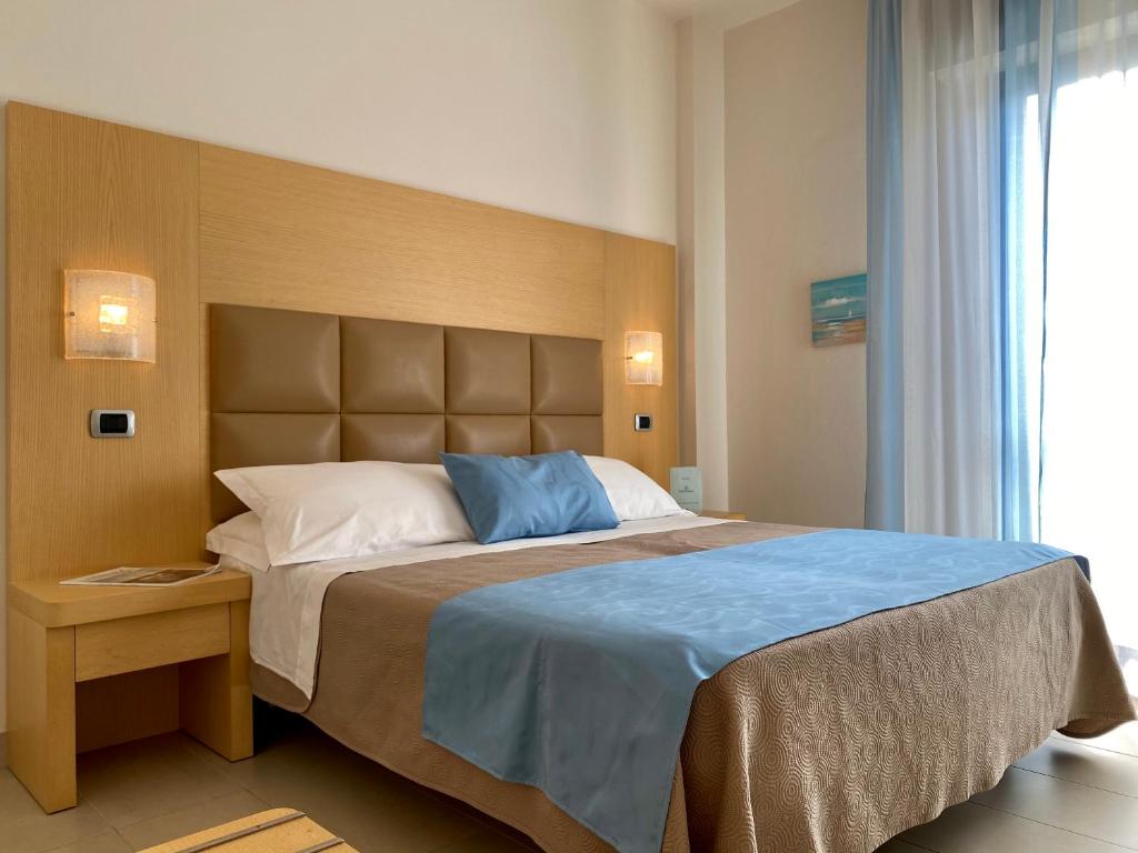 Postel nebo postele na pokoji v ubytování Hotel Granada