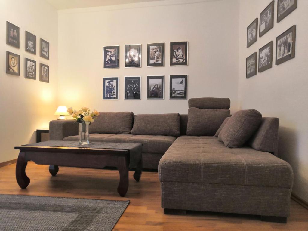 a living room with a couch and a coffee table at OlivApartment in Budapest