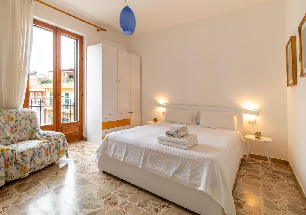Ένα ή περισσότερα κρεβάτια σε δωμάτιο στο Casa Caterina