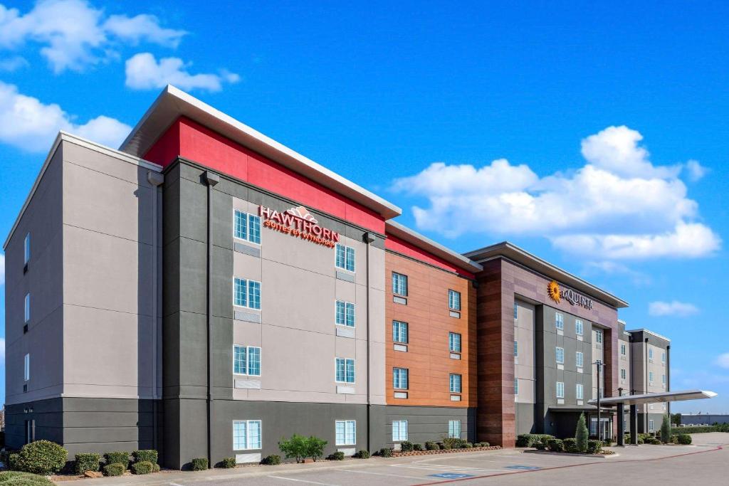 a rendering of a hotel with a building at Hawthorn Extended Stay by Wyndham Ardmore in Ardmore