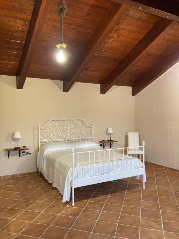 A bed or beds in a room at Masseria Le Zavattole