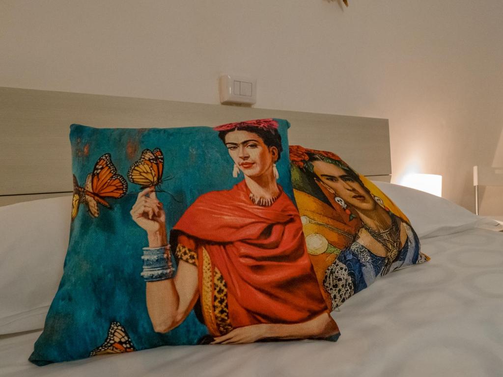 Postel nebo postele na pokoji v ubytování La Casa di Frida