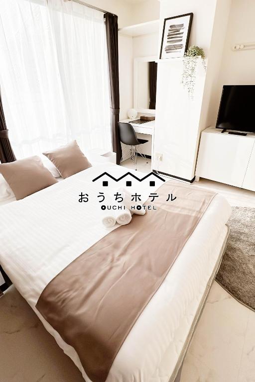 Postel nebo postele na pokoji v ubytování OUCHI HOTEL Fujimi
