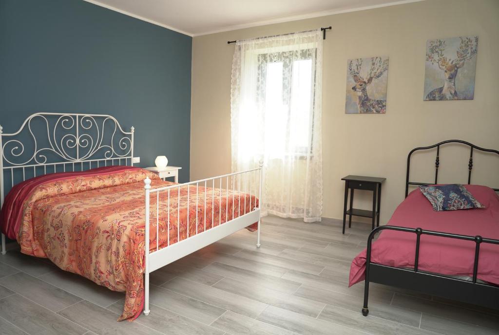 Posteľ alebo postele v izbe v ubytovaní Cascina Riva