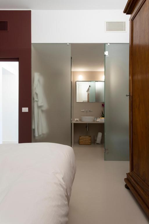 A bed or beds in a room at Piazza Fanti Luxury Apartments