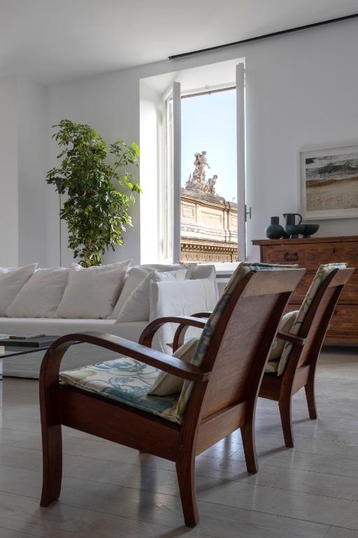A seating area at Piazza Fanti Luxury Apartments