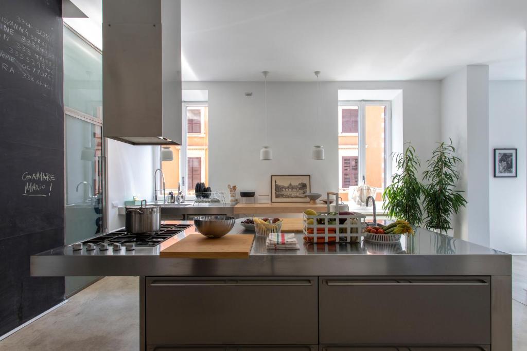 A kitchen or kitchenette at Piazza Fanti Luxury Apartments