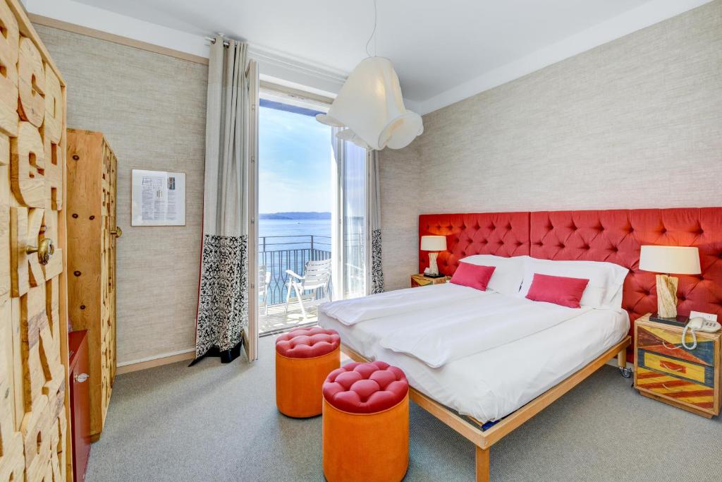 Uma cama ou camas num quarto em Hotel Flaminia
