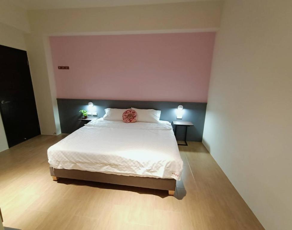 Postel nebo postele na pokoji v ubytování 佳宏馥居民宿