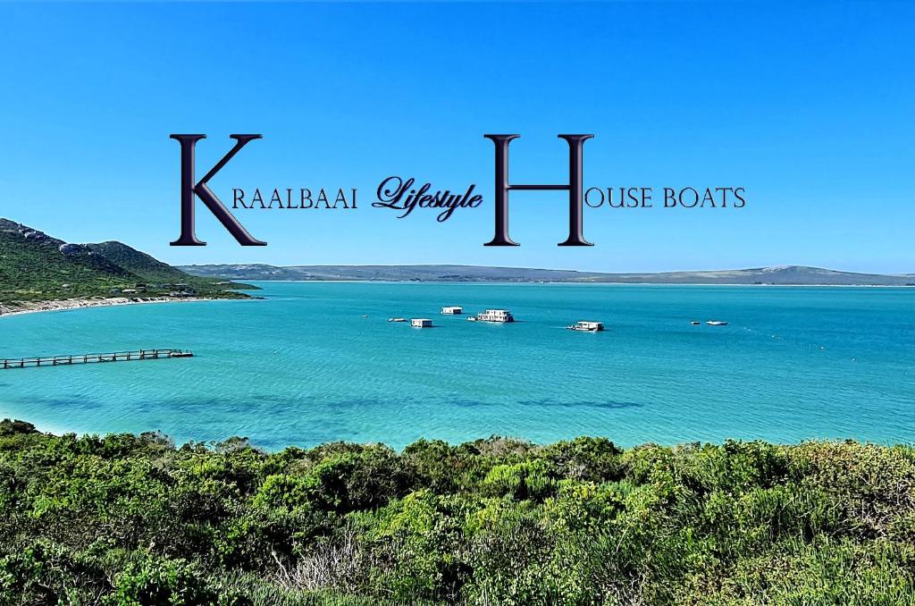 a view of a beach with boats in the water at Kraalbaai Lifestyle House Boats in Langebaan