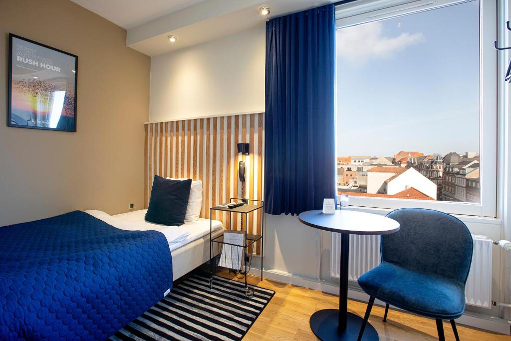 Postel nebo postele na pokoji v ubytování Hotel Britannia