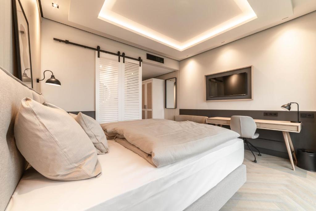 Postel nebo postele na pokoji v ubytování Fasson Hotel