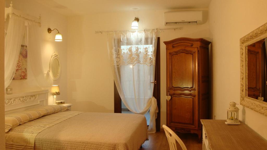 Postel nebo postele na pokoji v ubytování LA BARCHETTA suite