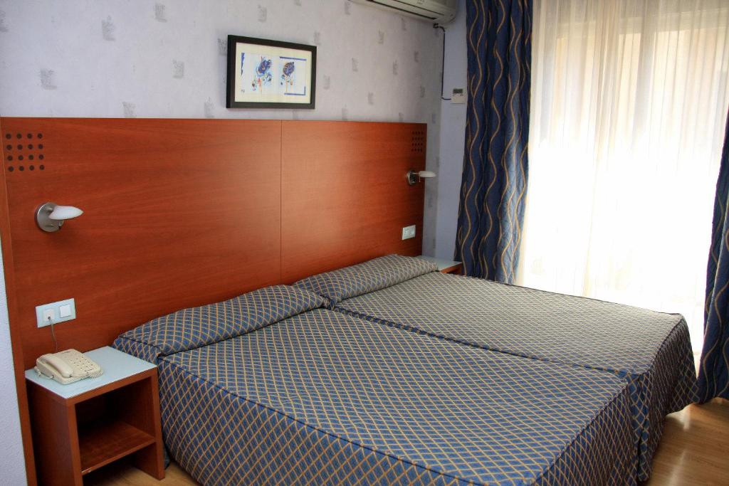 Postel nebo postele na pokoji v ubytování Hotel Xauen