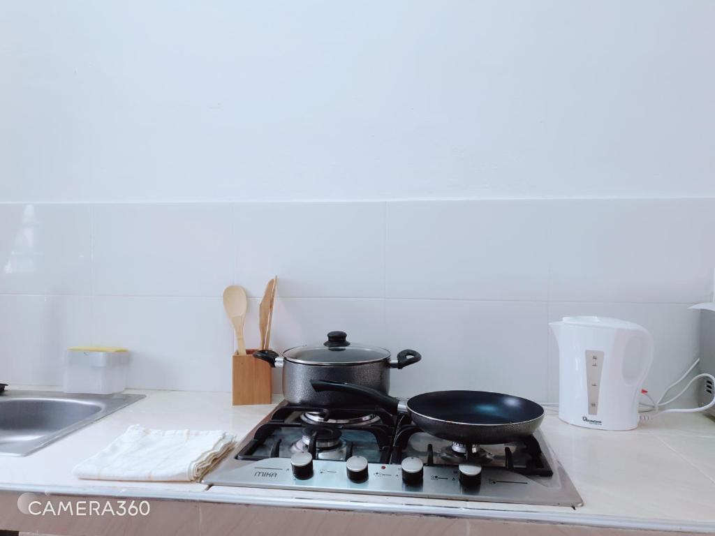 Kuchyň nebo kuchyňský kout v ubytování Diwani Cottage