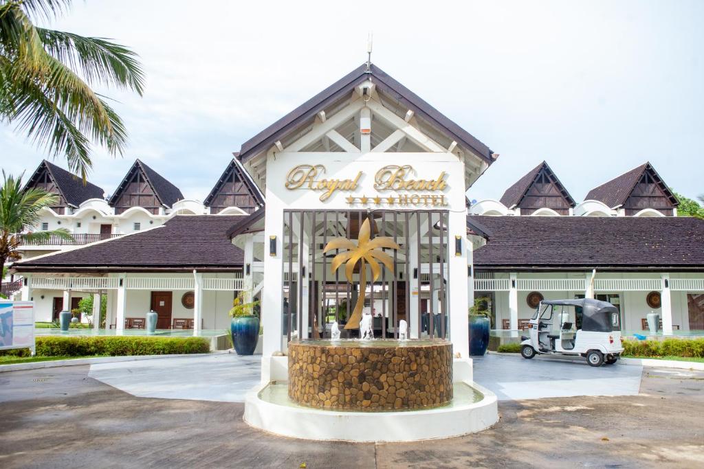 a sign for a store in front of a resort at Royal Beach Hôtel in Ambatoloaka