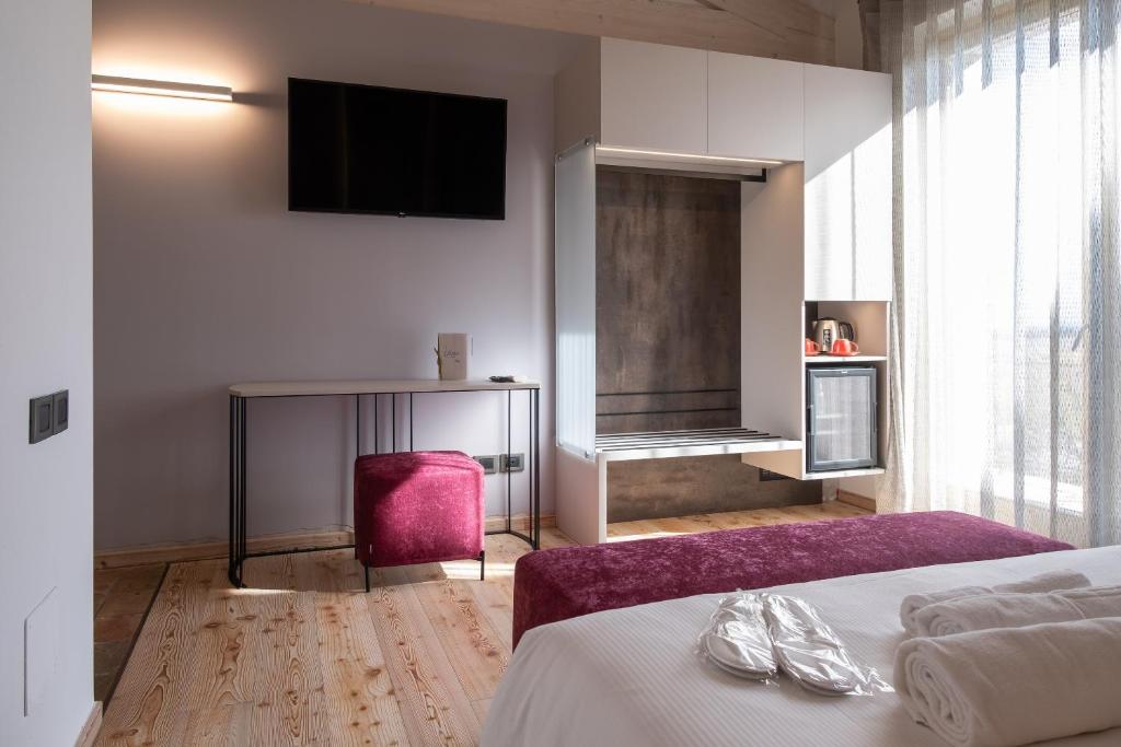 Postel nebo postele na pokoji v ubytování La Cipressina B&B
