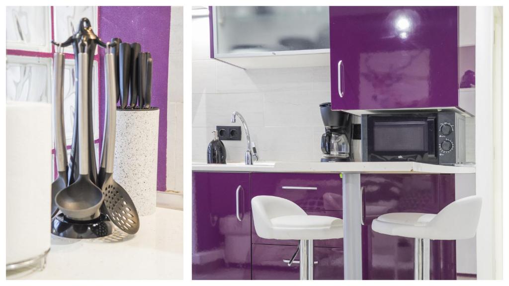 A kitchen or kitchenette at La Casa Púrpura - Apartamentos Aloha Toledo