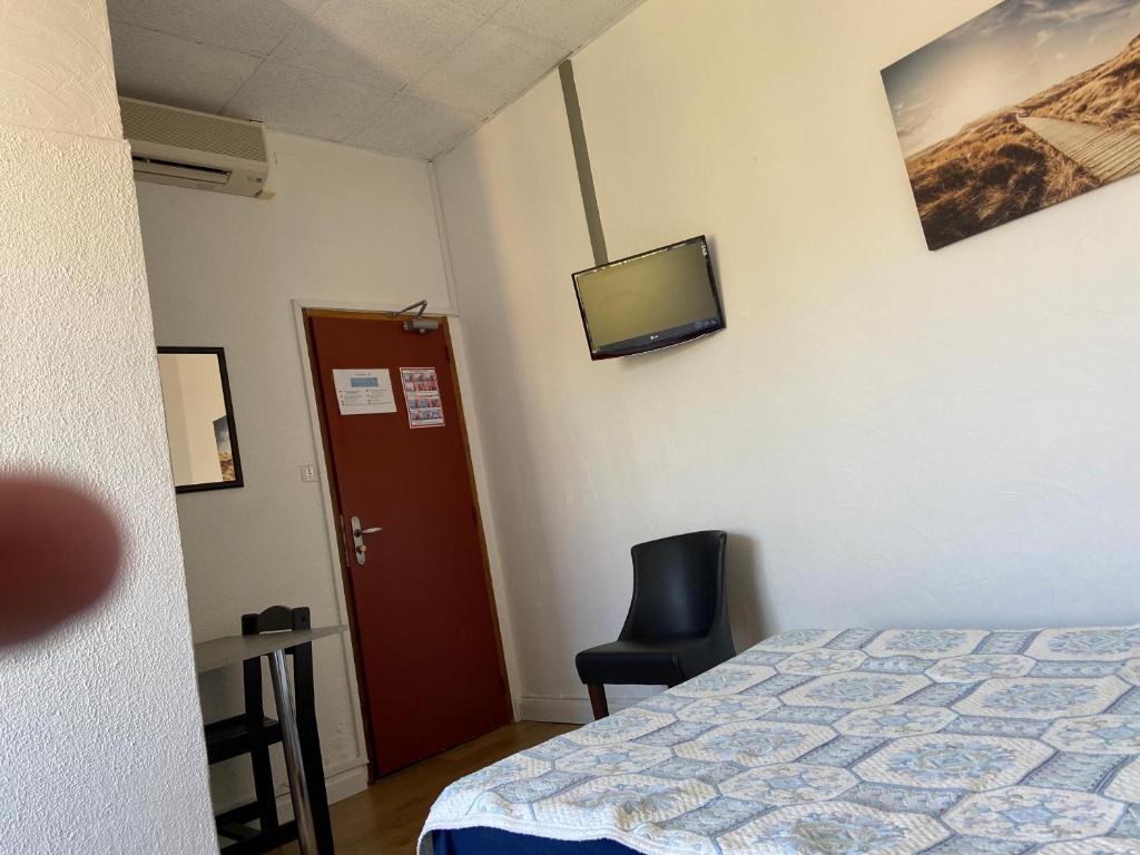 Postel nebo postele na pokoji v ubytování Hôtel Belle Vue d'Angleterre