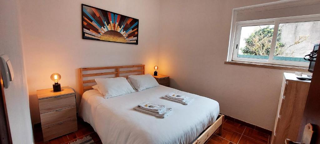 Ένα ή περισσότερα κρεβάτια σε δωμάτιο στο Stone House - Sintra Rural