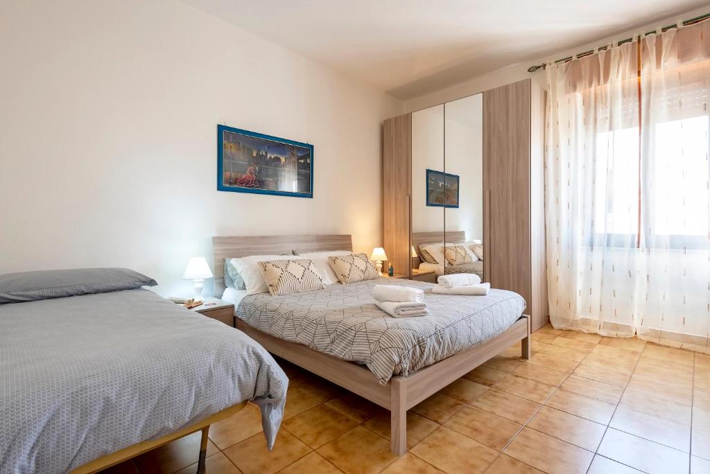Postel nebo postele na pokoji v ubytování Sardinia rooms