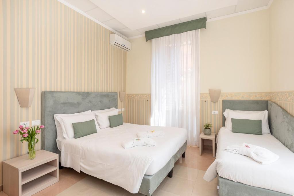 Postel nebo postele na pokoji v ubytování Hotel Parker - Gruppo BLAM HOTELS