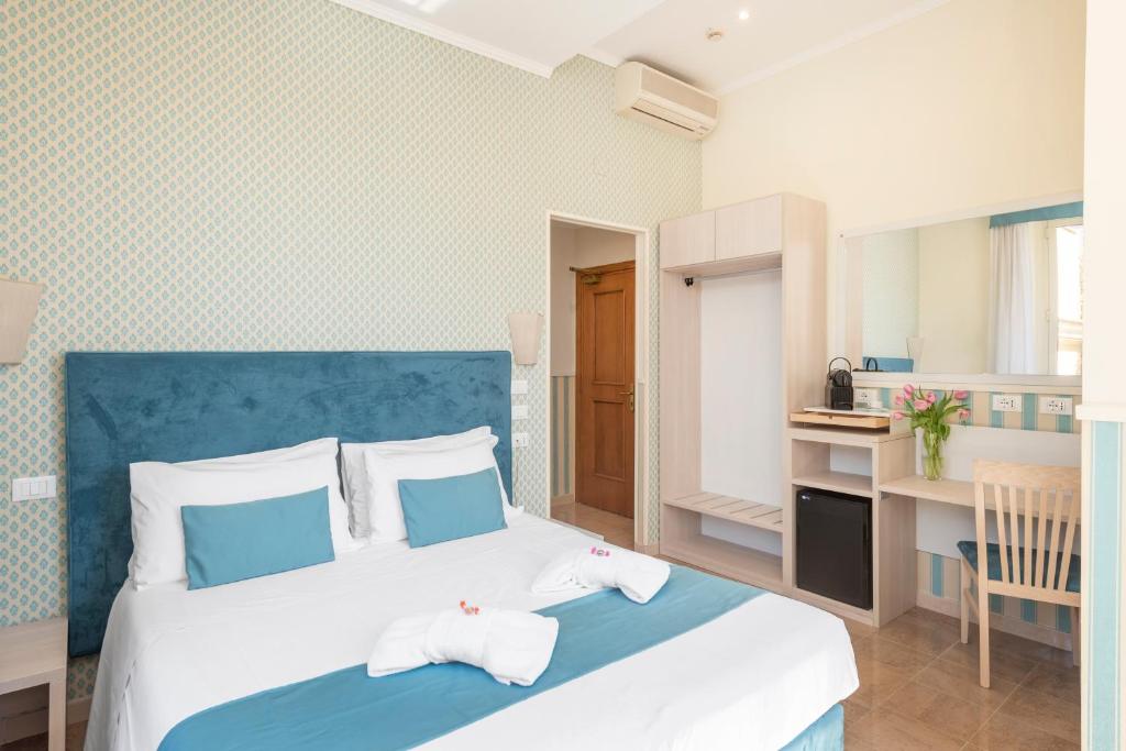 Postel nebo postele na pokoji v ubytování Hotel Parker - Gruppo BLAM HOTELS