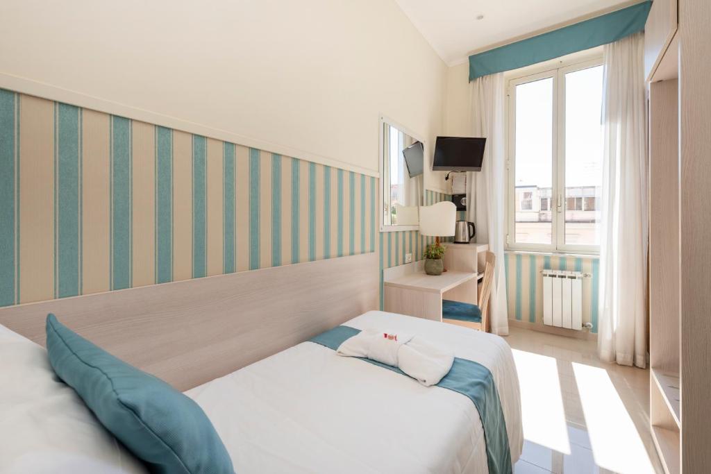 Postel nebo postele na pokoji v ubytování Hotel Parker - Gruppo BLAM HOTELS