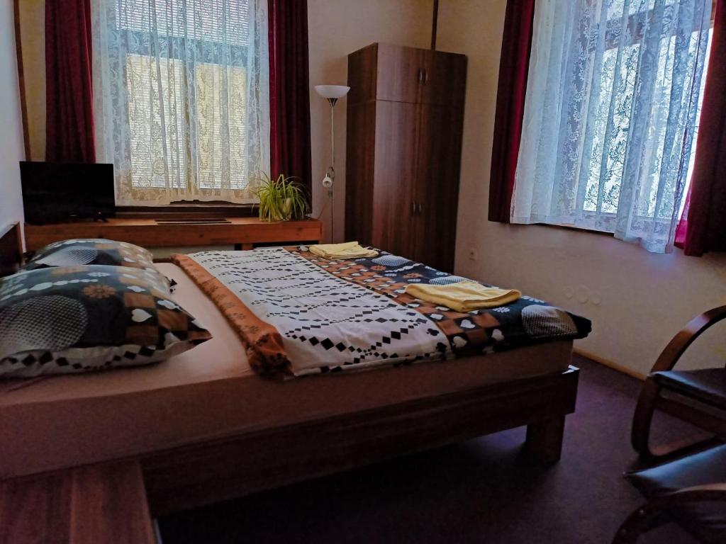Postel nebo postele na pokoji v ubytování Penzion Rudolf