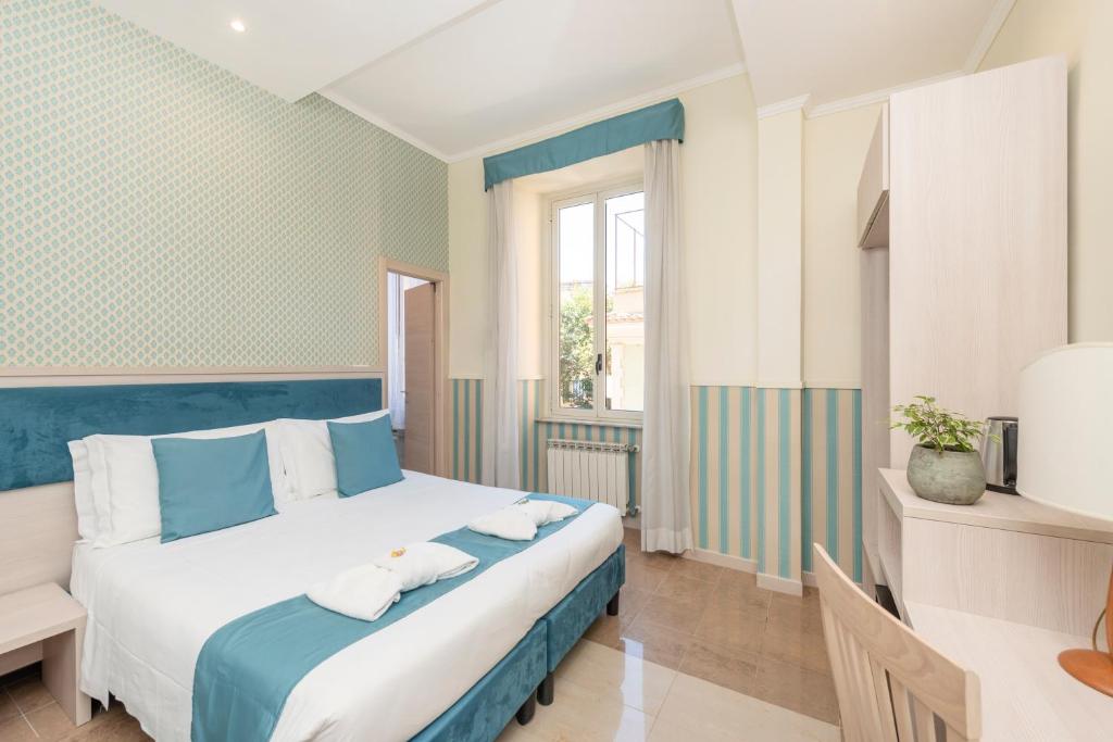 Postel nebo postele na pokoji v ubytování Hotel Parker - Gruppo BLAM HOTELS