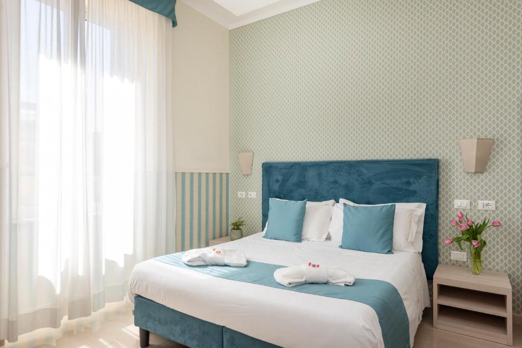 Postel nebo postele na pokoji v ubytování Hotel Parker - Gruppo BLAM HOTELS