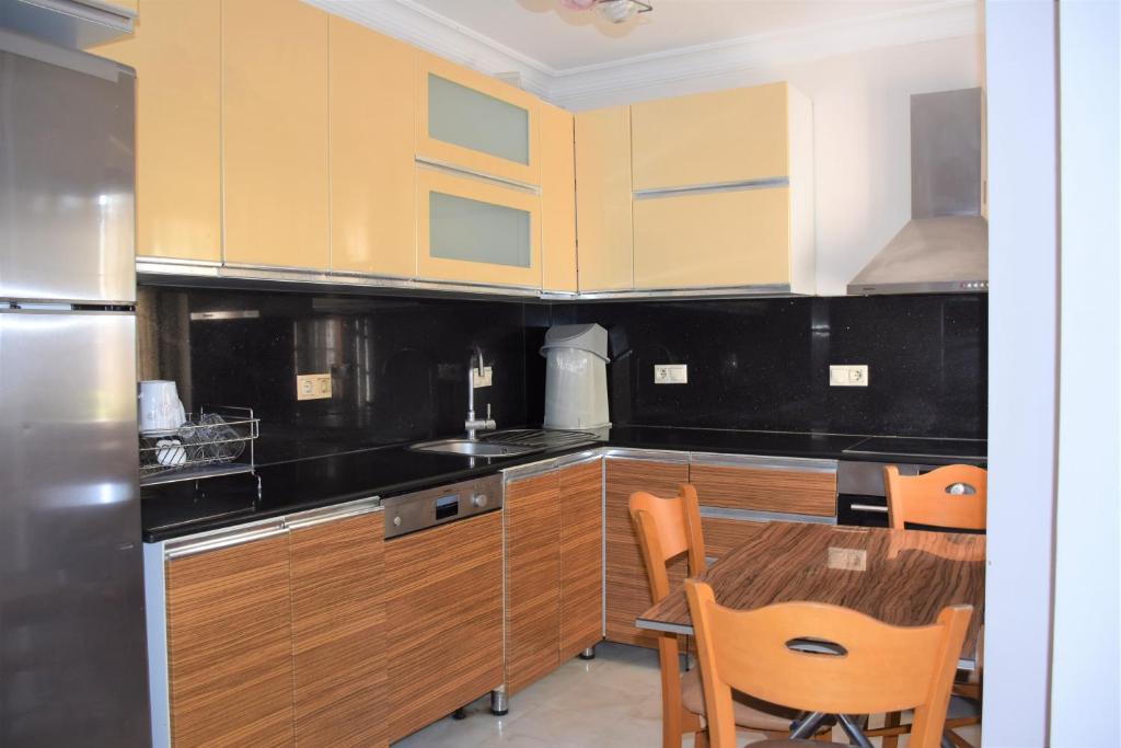 Kuchyň nebo kuchyňský kout v ubytování Dinara Hotel