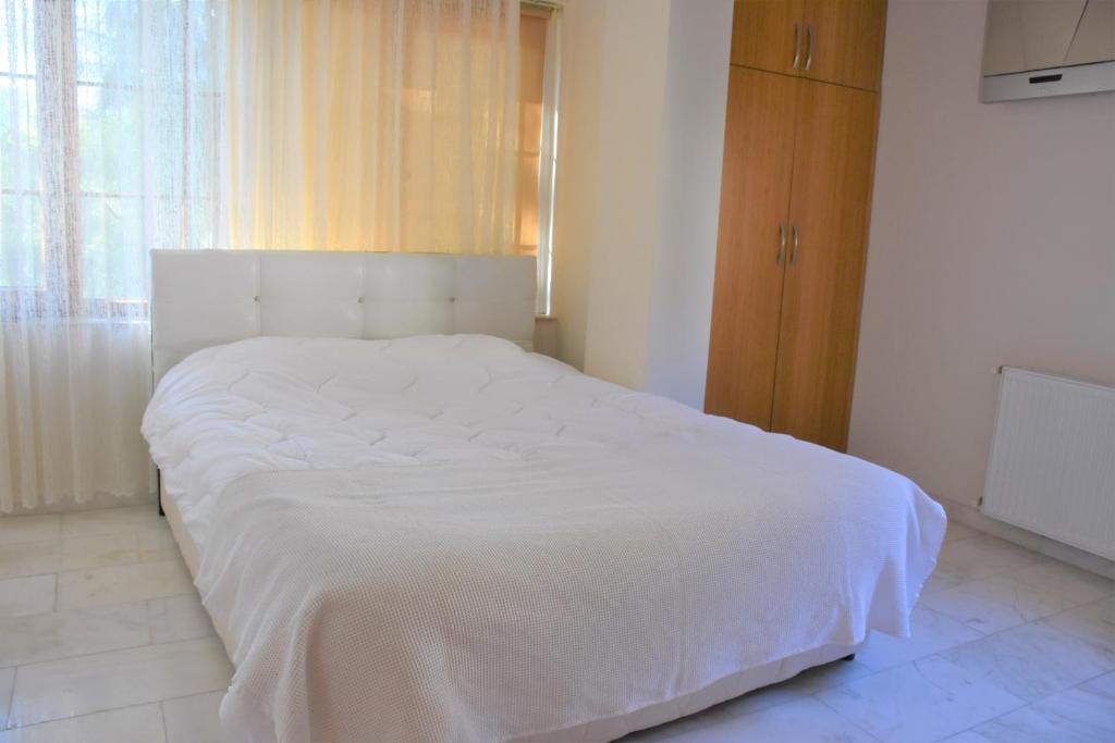 Postel nebo postele na pokoji v ubytování Dinara Hotel