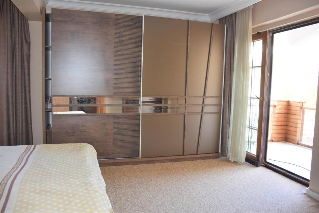Postel nebo postele na pokoji v ubytování Dinara Hotel