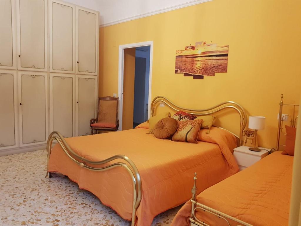 Postel nebo postele na pokoji v ubytování La casa di Rosa - Casa Vacanze