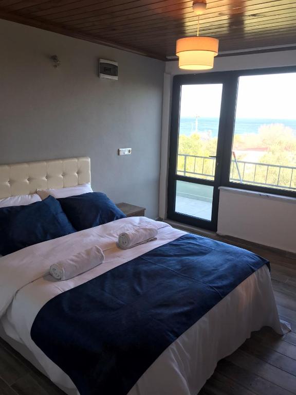 Postel nebo postele na pokoji v ubytování Assos No9 Hotel