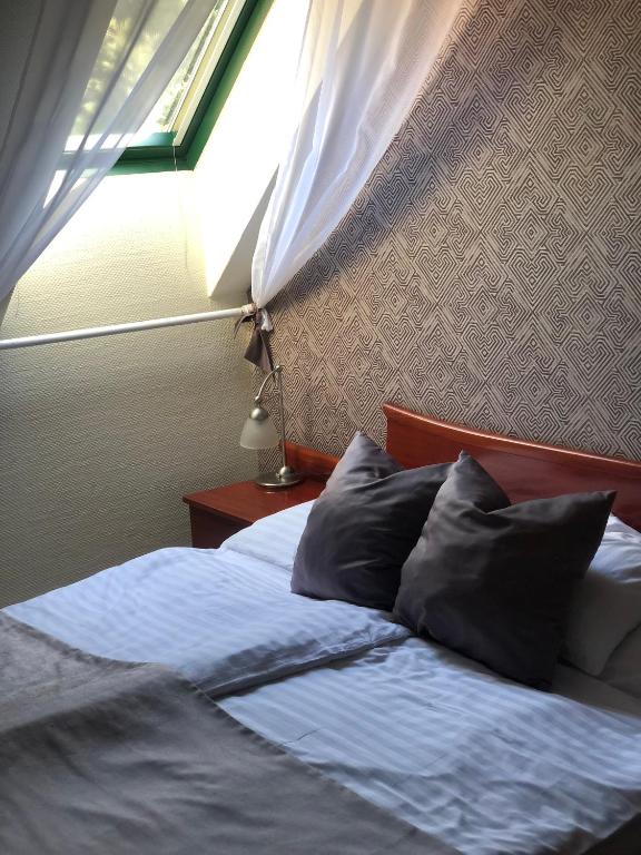 Postel nebo postele na pokoji v ubytování Aqua Villa Eger