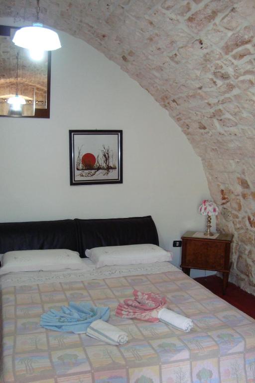 Postel nebo postele na pokoji v ubytování Masseria SD di Manchisi