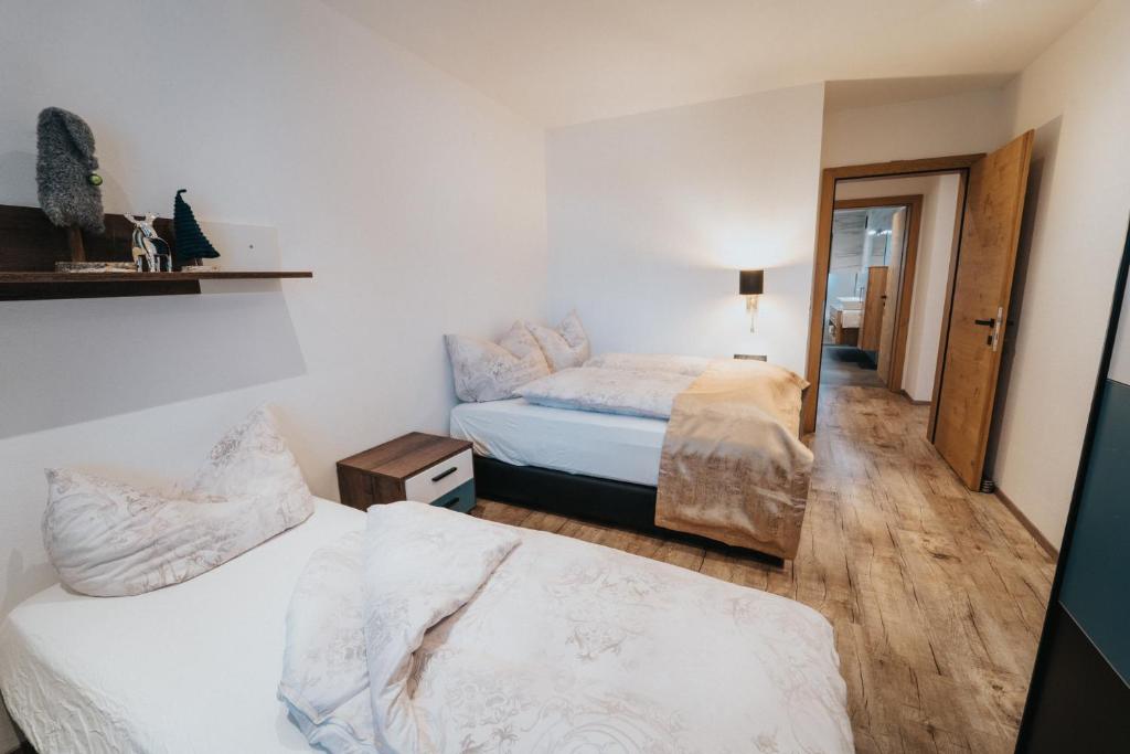 Postel nebo postele na pokoji v ubytování Apartklusiv Kaltenbach