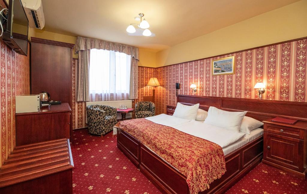 a hotel room with a bed in a room at Old Prague Hotel in Prague