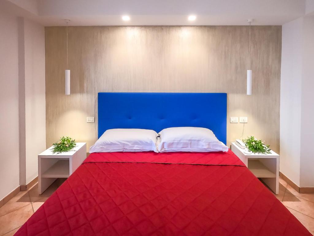 Postel nebo postele na pokoji v ubytování Hotel Martino