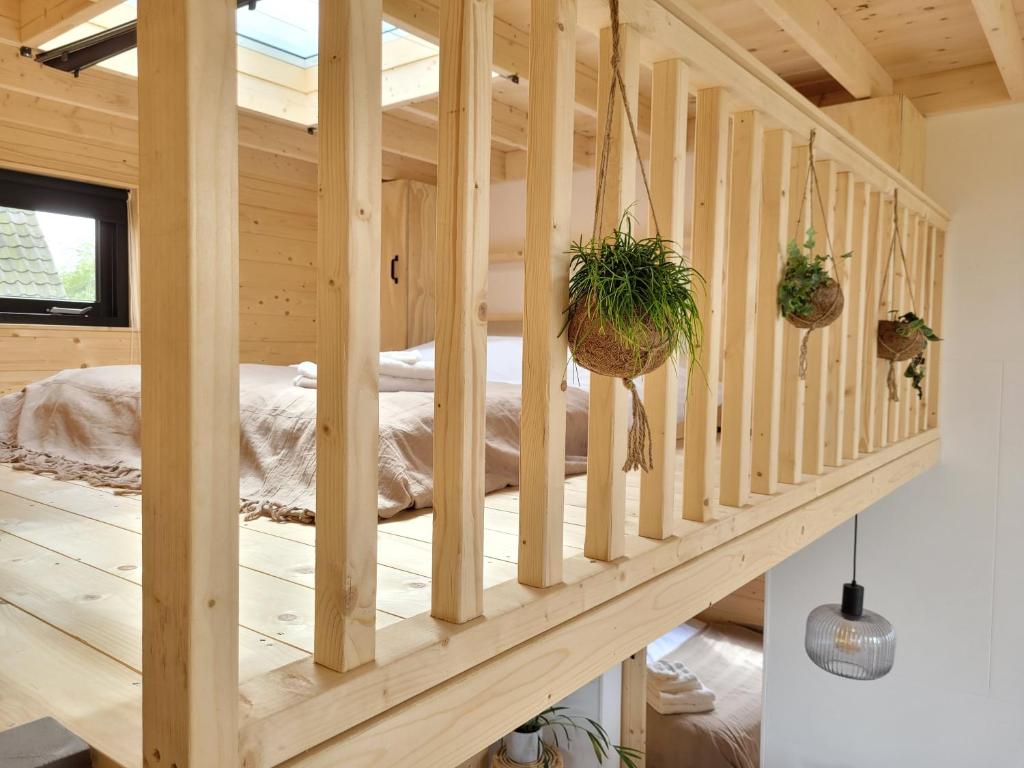 Postel nebo postele na pokoji v ubytování Tiny House Lantliv Oostkapelle, bij de boer