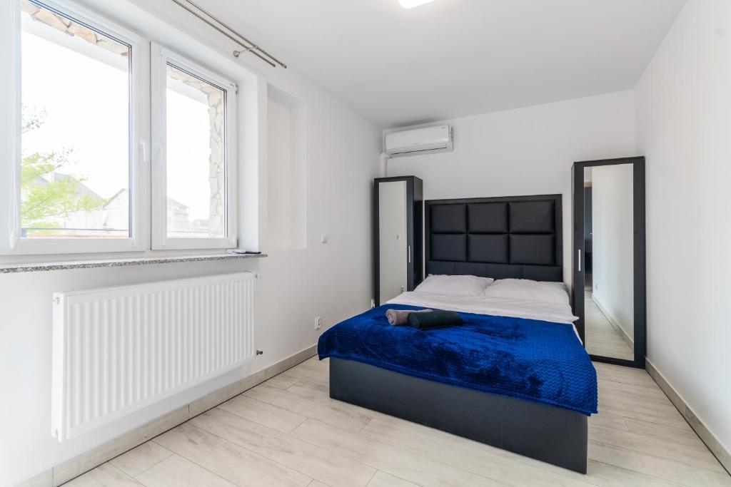 Postel nebo postele na pokoji v ubytování VIP House Apartamenty