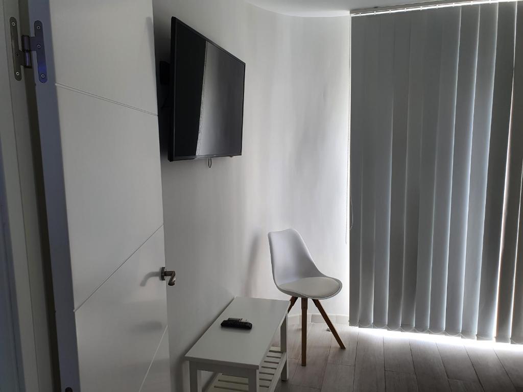 Telewizja i/lub zestaw kina domowego w obiekcie Paraiso