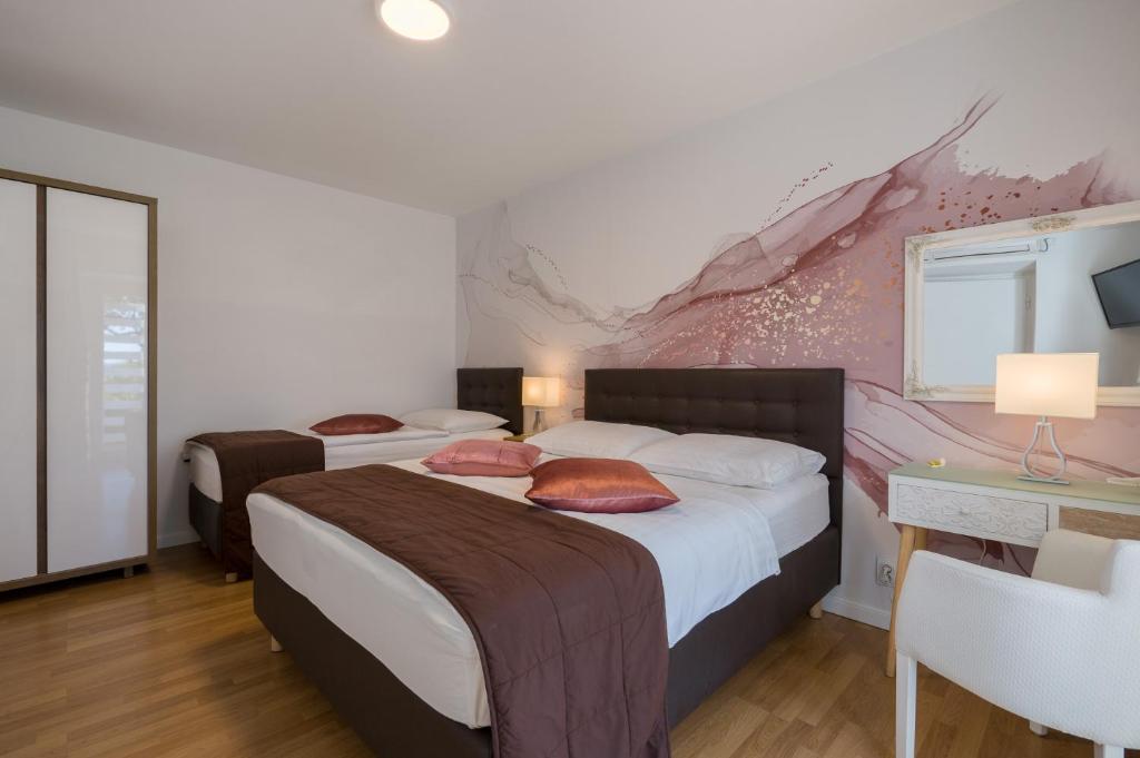 Postel nebo postele na pokoji v ubytování Apartments Zicara
