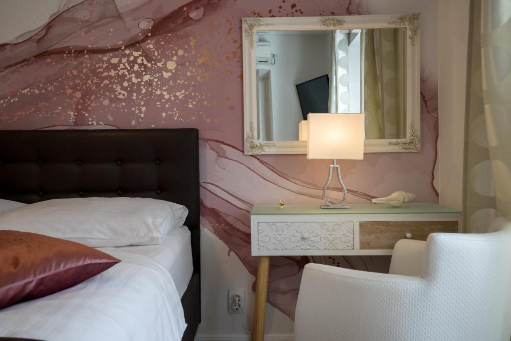 Postel nebo postele na pokoji v ubytování Apartments Zicara