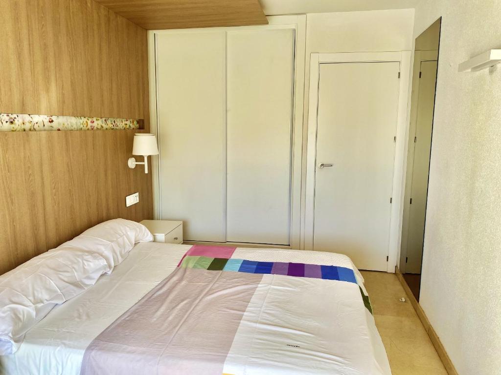 A bed or beds in a room at Modern Apartment in Salou - 50 m² + Pool