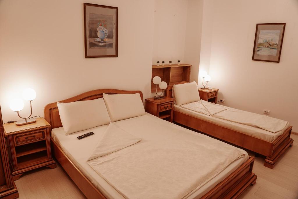 Postel nebo postele na pokoji v ubytování Escape Pensiune