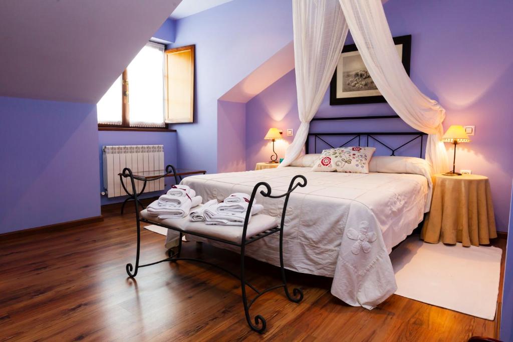 Cama o camas de una habitación en Hotel Rural As Laguas