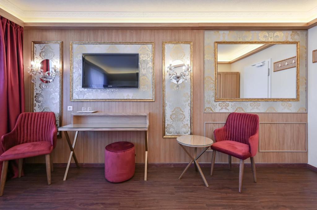 TV a/nebo společenská místnost v ubytování Hotel Ludwigs
